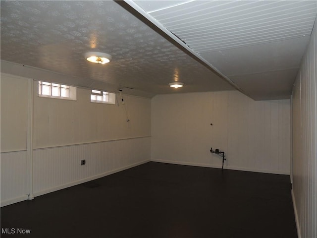 basement with a textured ceiling