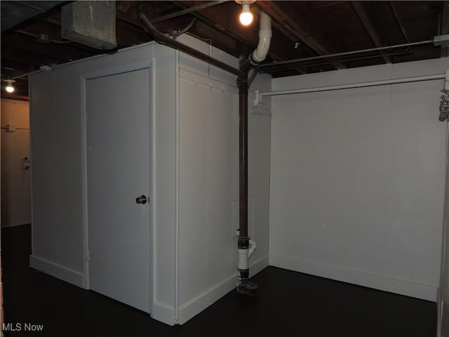 basement featuring baseboards
