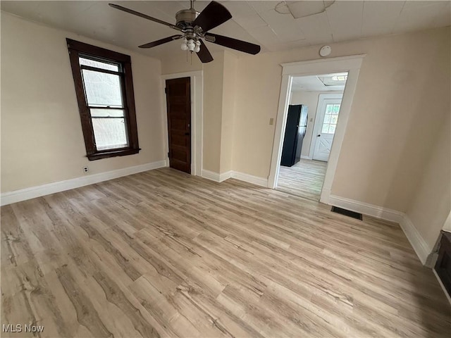 807 Virginia Ave, Follansbee, WV 26037 - unfurnished room featuring ceiling fan, baseboards, visible vents, and light wood-type flooring