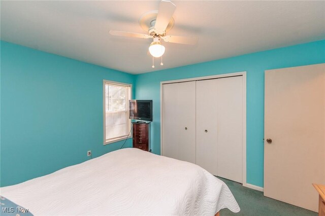 carpeted bedroom with ceiling fan and a closet
