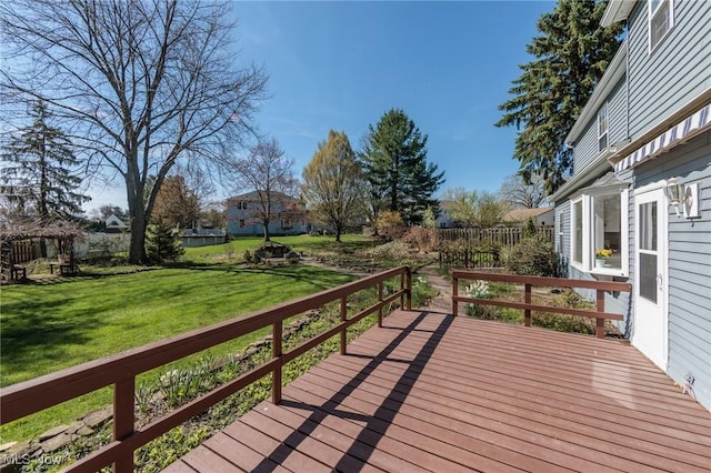 wooden deck with a lawn