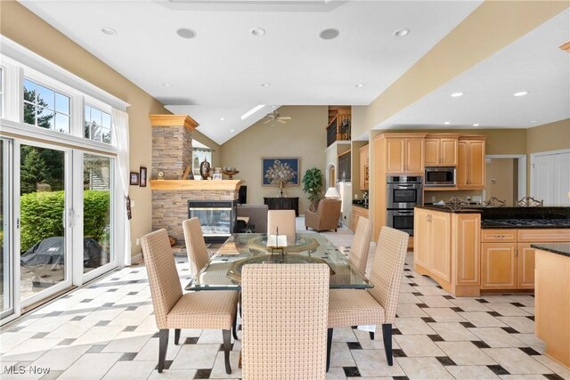 420 Wakefield Run Blvd, Hinckley, OH 44233 - dining room with a stone fireplace, recessed lighting, ceiling fan, and vaulted ceiling