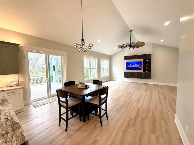 dining space with light wood finished floors, baseboards, recessed lighting, a notable chandelier, and lofted ceiling