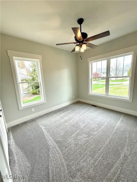 6028 Arlyne Ln, Medina, OH 44256 - empty room with ceiling fan, baseboards, and carpet floors