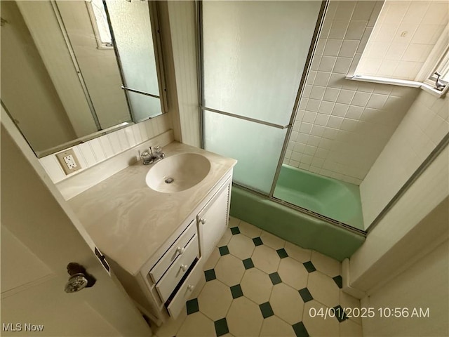 224 E Pine St, Lisbon, OH 44432 - bathroom featuring combined bath / shower with glass door, vanity, and tile patterned floors