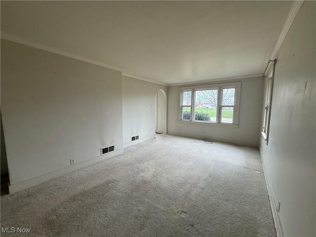 224 E Pine St, Lisbon, OH 44432 - carpeted empty room featuring arched walkways, visible vents, and crown molding