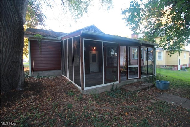 224 E Pine St, Lisbon, OH 44432 - rear view of property with a sunroom