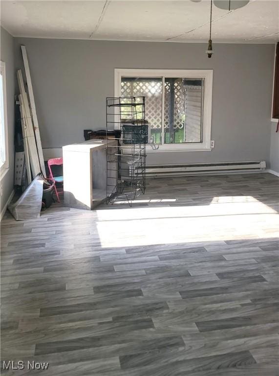 135 Paradise Blvd, Madison, OH 44057 - dining room with baseboards, wood finished floors, and a wealth of natural light