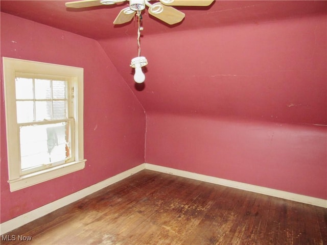 additional living space featuring ceiling fan, lofted ceiling, hardwood / wood-style floors, and baseboards