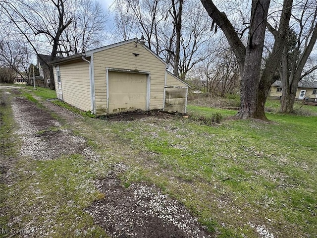 detached garage featuring driveway