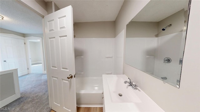bathroom featuring walk in shower, vanity, and a bathtub