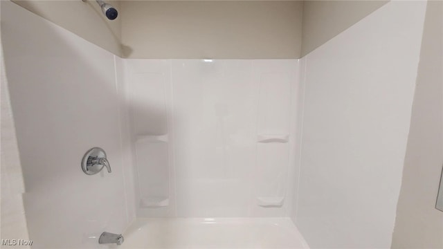 full bathroom featuring  shower combination