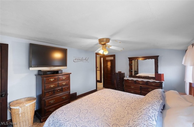 bedroom with baseboards and a ceiling fan