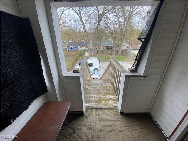 doorway to outside featuring a residential view