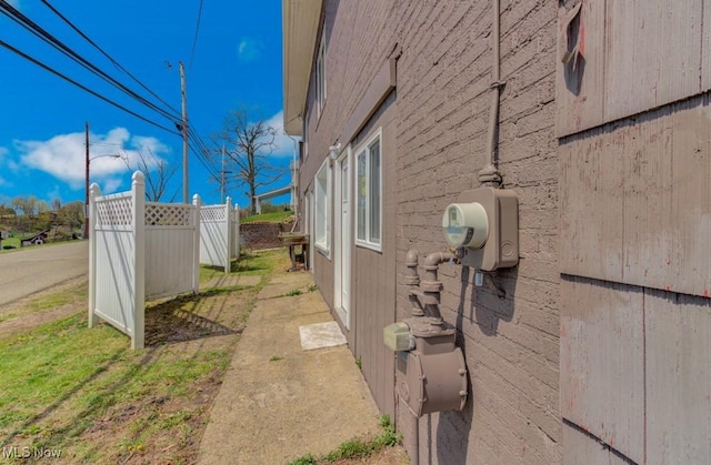 view of home's exterior featuring fence