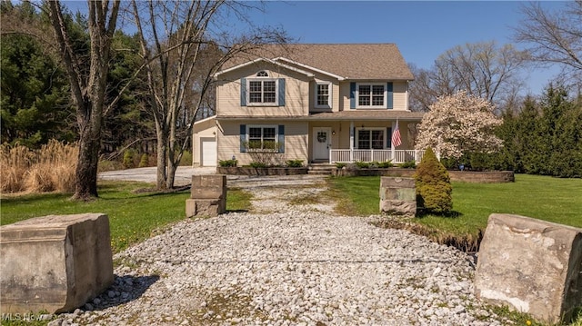 760 N Medina Line Rd, Akron, OH 44333 - traditional home with a front lawn, driveway, covered porch, and a garage