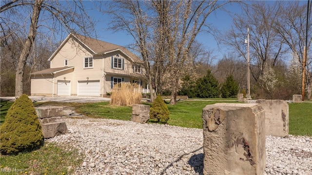 760 N Medina Line Rd, Akron, OH 44333 - view of property exterior featuring driveway, a yard, and a garage