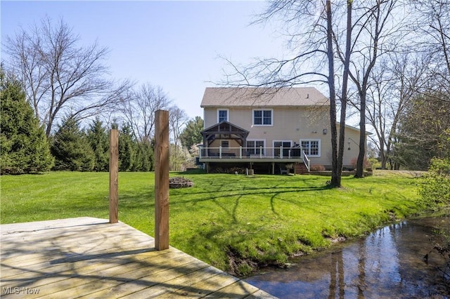 760 N Medina Line Rd, Akron, OH 44333 - back of property featuring a lawn, a deck with water view, and stairway