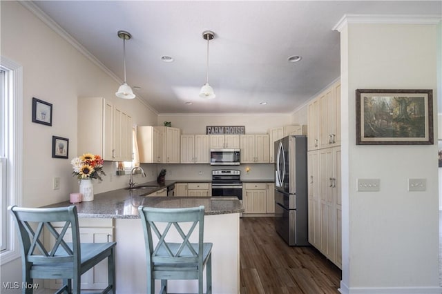 760 N Medina Line Rd, Akron, OH 44333 - kitchen featuring stainless steel appliances, cream cabinetry, a peninsula, ornamental molding, and dark wood-type flooring
