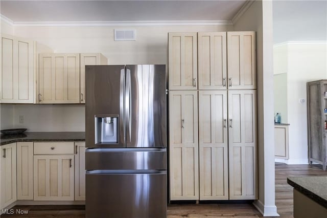 760 N Medina Line Rd, Akron, OH 44333 - kitchen with dark wood-style floors, crown molding, visible vents, and stainless steel fridge