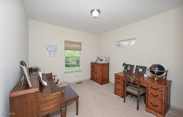 office space featuring light carpet and visible vents