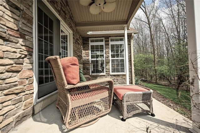 view of patio with a porch and ceiling fan