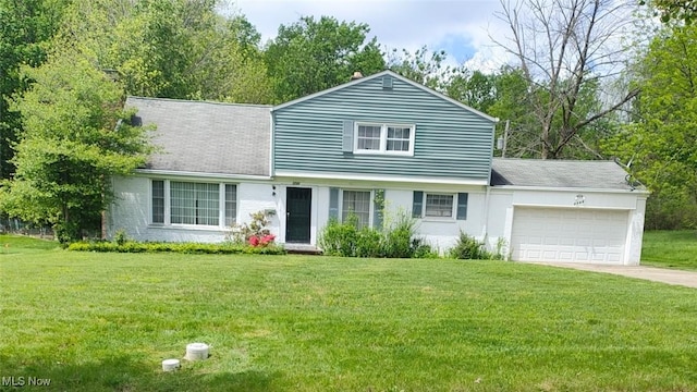 3742 Concord Dr, Beachwood, OH 44122 - view of front facade featuring a garage, a front yard, and concrete driveway