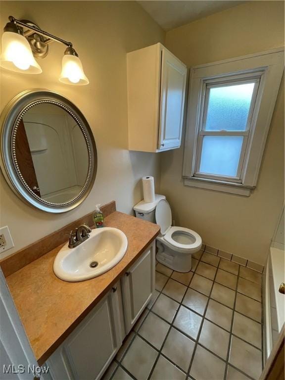 7706 Connecticut Ave, Garfield Heights, OH 44105 - bathroom with vanity, tile patterned flooring, and toilet