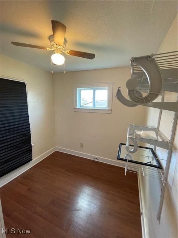 7706 Connecticut Ave, Garfield Heights, OH 44105 - unfurnished room featuring wood finished floors, baseboards, and ceiling fan