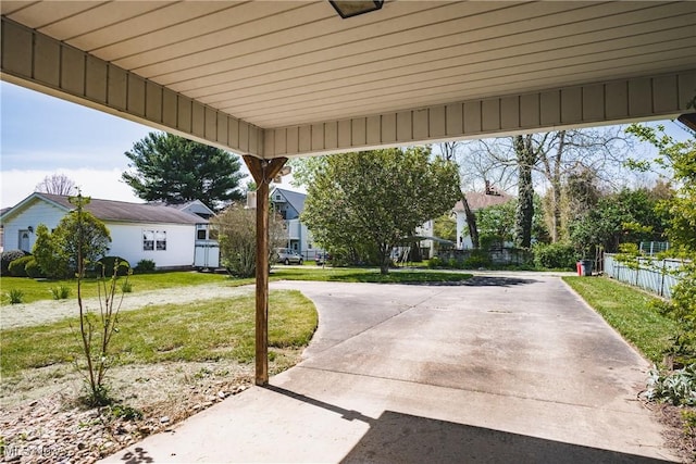 view of patio featuring fence and a residential view