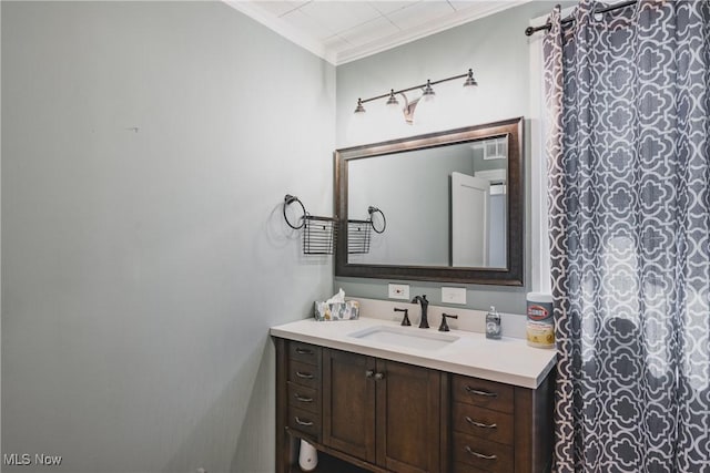 full bathroom featuring vanity and ornamental molding