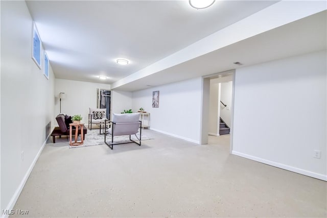 interior space with stairway and baseboards