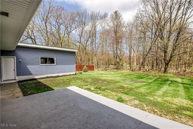 view of yard featuring a patio area and fence