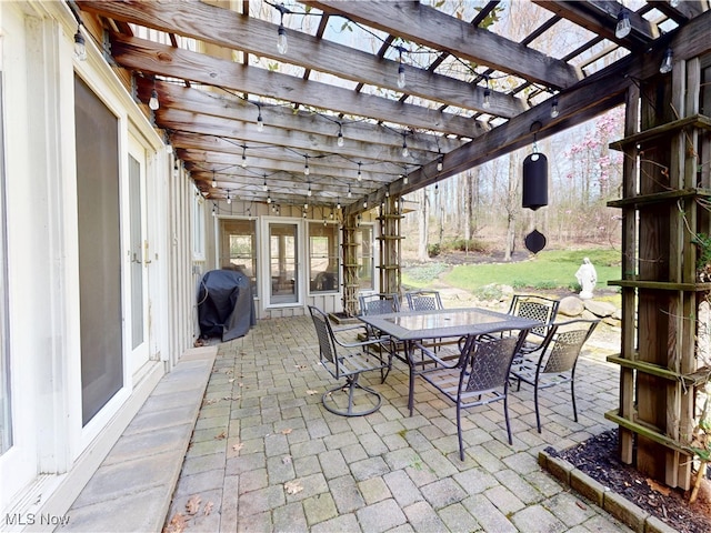 view of patio with outdoor dining area, a pergola, and a grill