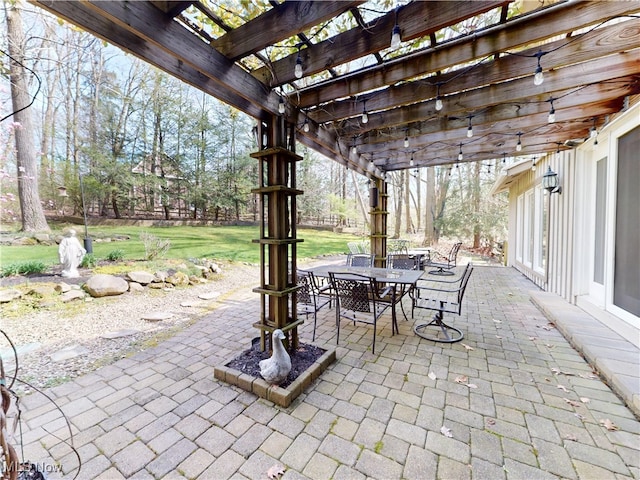view of patio with outdoor dining area and a pergola