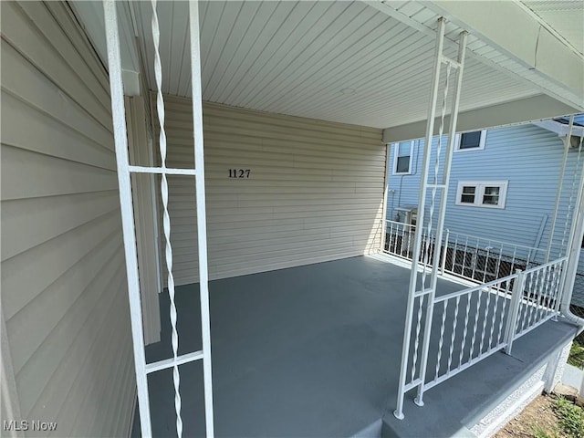 view of patio / terrace with an attached carport