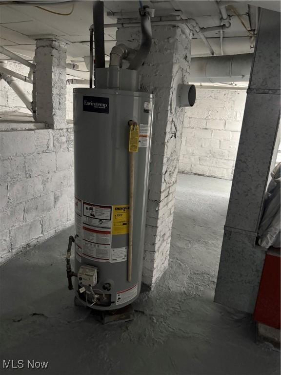 utility room featuring water heater