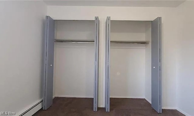 closet featuring a baseboard radiator
