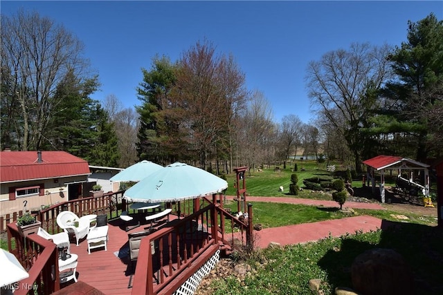 deck with a gazebo and a lawn