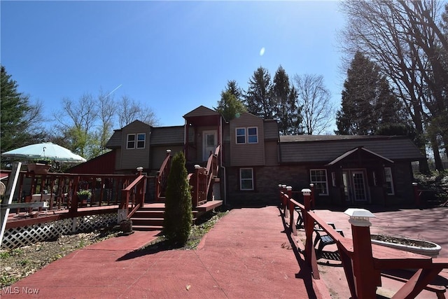 exterior space featuring a wooden deck