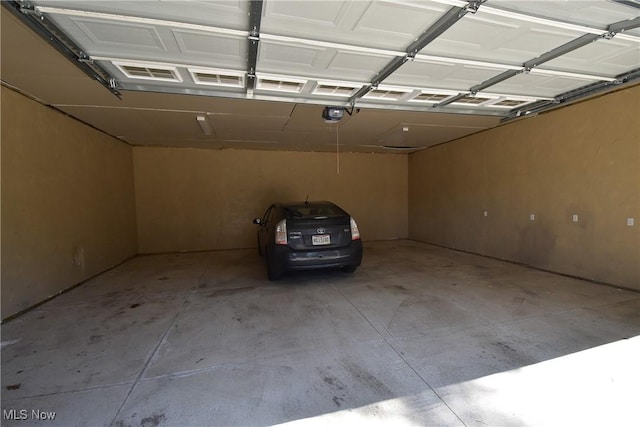 garage featuring a garage door opener