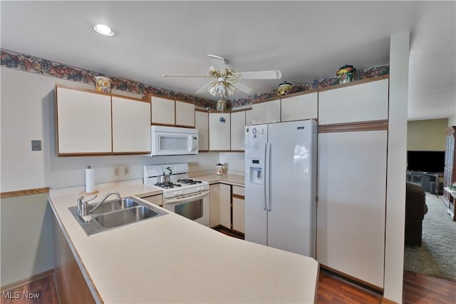 810 Southwestern Run Unit 19, Poland, OH 44514 - kitchen with a sink, light countertops, white appliances, a ceiling fan, and a peninsula