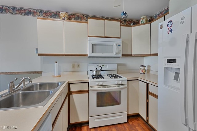 810 Southwestern Run Unit 19, Poland, OH 44514 - kitchen featuring light countertops, a sink, wood finished floors, and white appliances