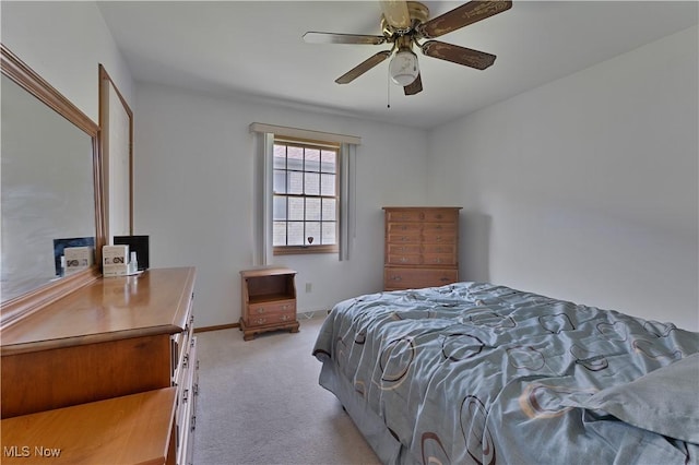 810 Southwestern Run Unit 19, Poland, OH 44514 - bedroom with ceiling fan, light carpet, and baseboards
