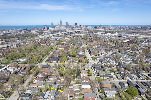 bird's eye view featuring a city view, a residential view, and a water view