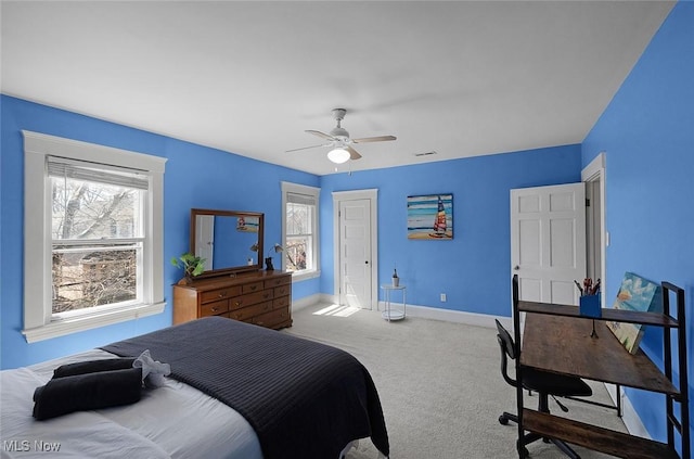 bedroom featuring visible vents, a ceiling fan, carpet flooring, and baseboards