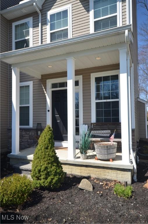 entrance to property featuring a porch