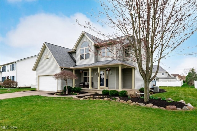 traditional-style home with covered porch, a front lawn, concrete driveway, and central air condition unit