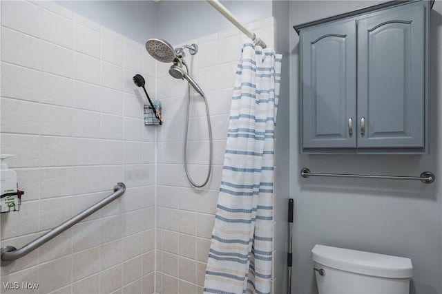full bath featuring toilet and tiled shower