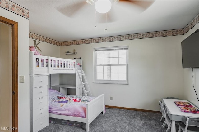 bedroom with ceiling fan, carpet flooring, and baseboards